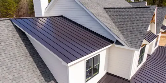 Roof with metal and asphalt shingles