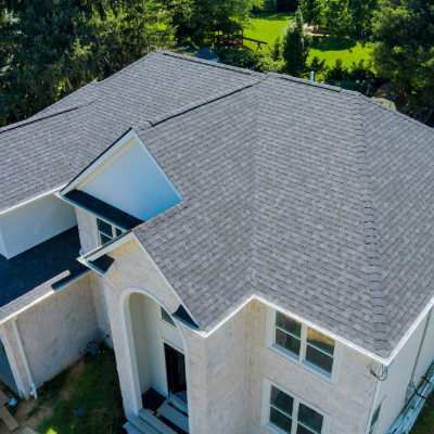 An aerial view of a home with architectural asphalt shingles.