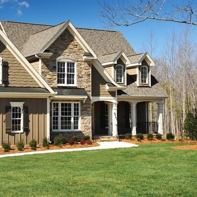 Newly constructed home featuring a finished asphalt shingle roof