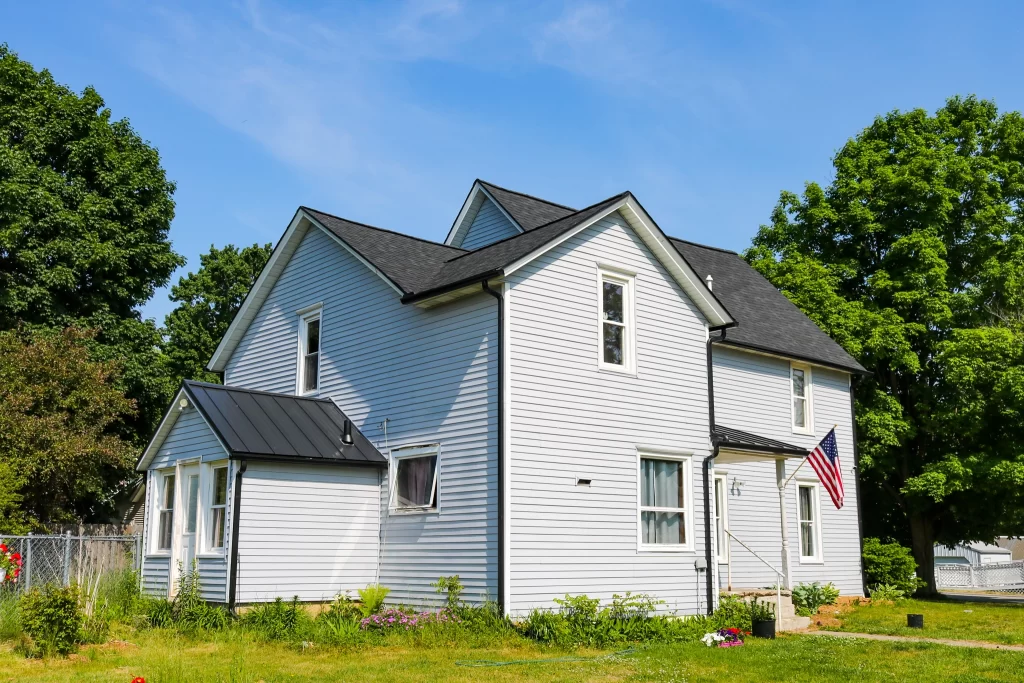 Moore & Sons shingle roof with American flag