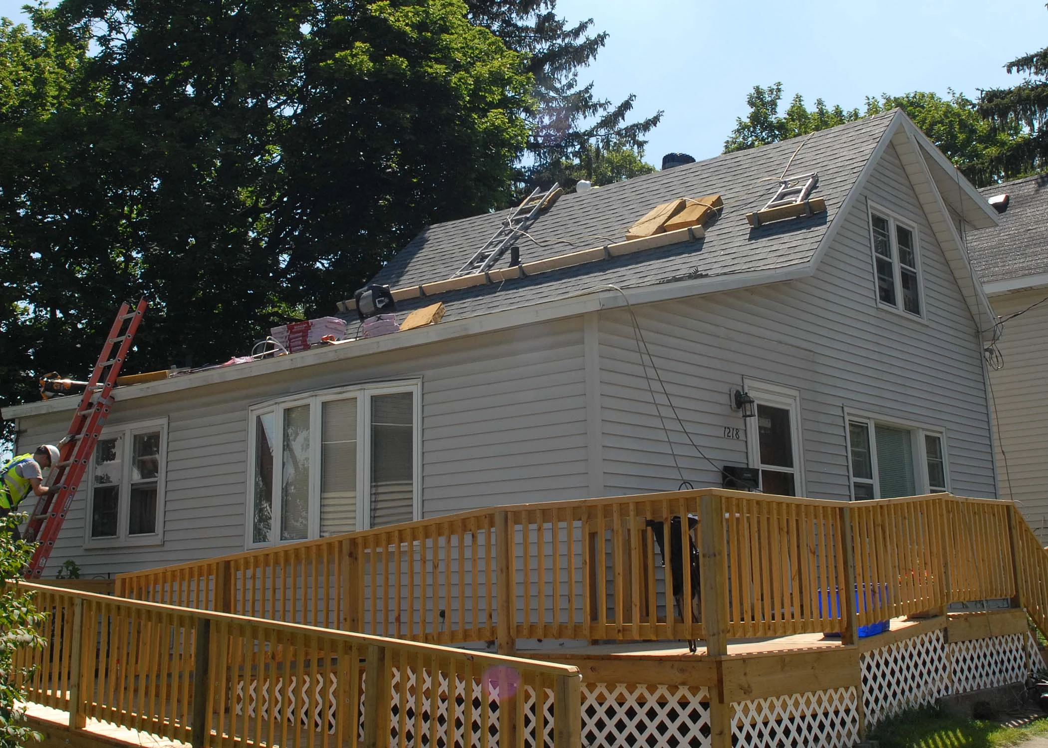 Asphalt roof being replaced