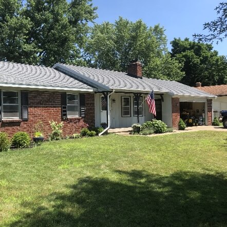 A new metal roof installation by Moore and Sons Roofing on a home in Michigan.