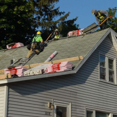 roofers repairing a roof
