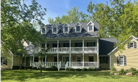 Home with Double Balcony and new Asphalt shingle roof and multiple dormers
