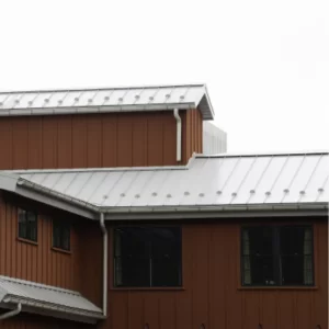 Metal roof on a brown home.